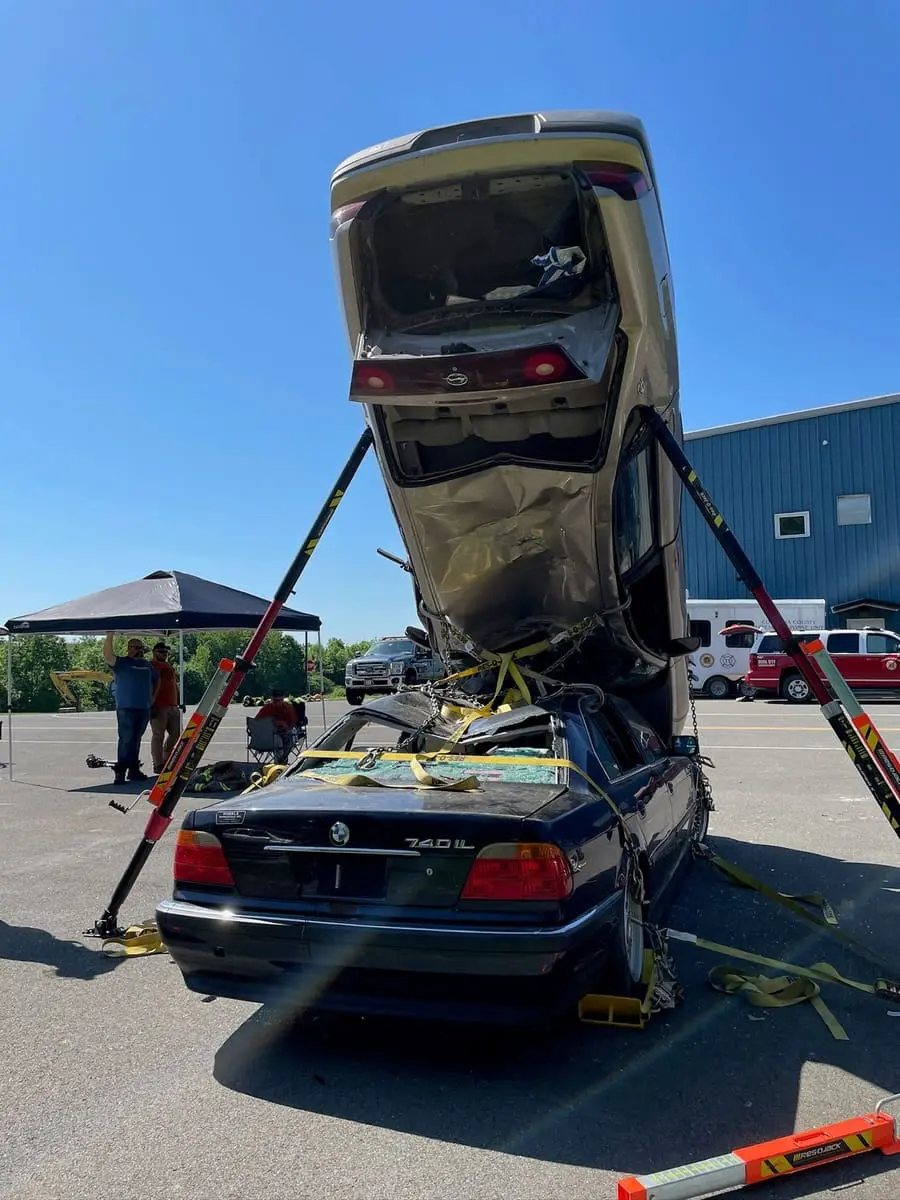 Ghent firefighters training with Res-Q-Jack vehicle stabilization struts during an evening drill