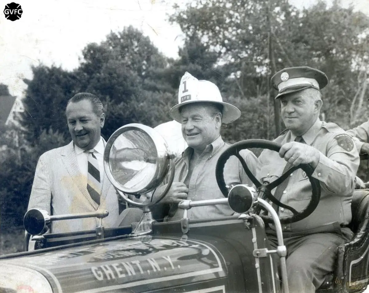 Gov. Nelson Rockefeller in Engine No. 1 — Governor Rockefeller wearing a Ghent 'Chief 1' helmet at the Chatham Fair.