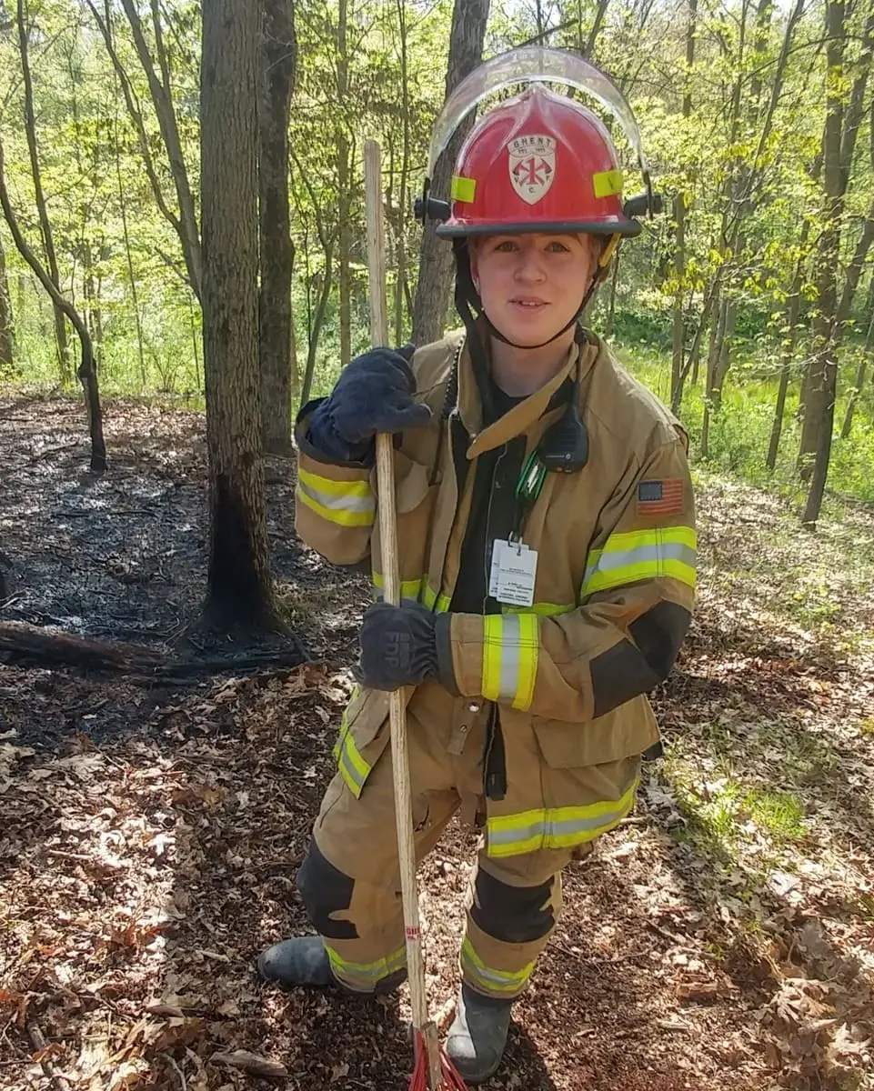 Brush Fire Containment Line — Volunteers working the blackened perimeter of a spring brush fire to prevent rekindle.